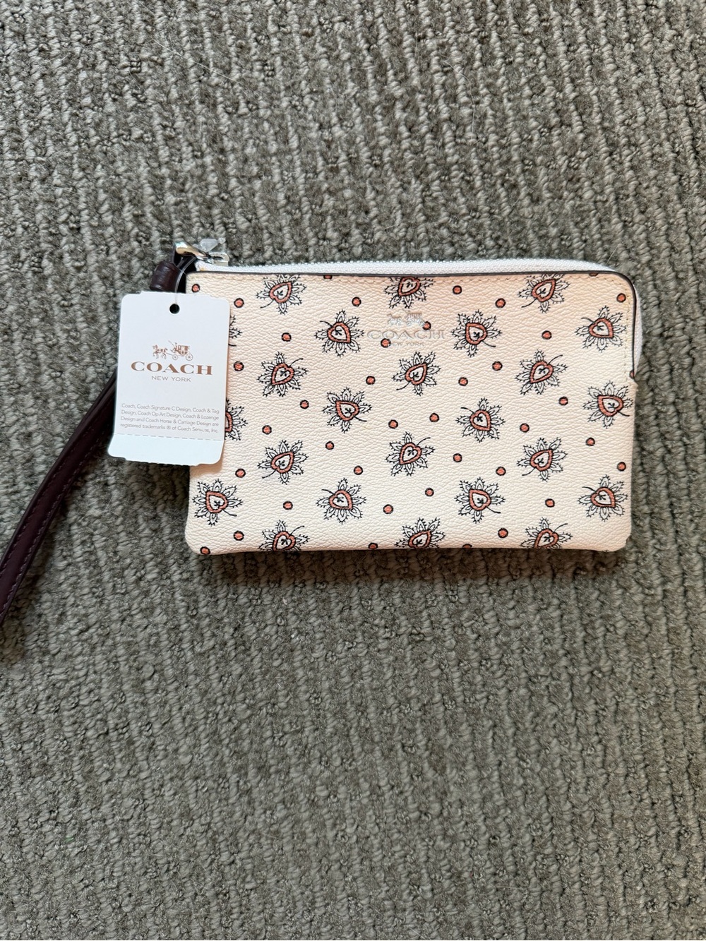 Coach Peach Floral Wristlet with Dark Brown Strap